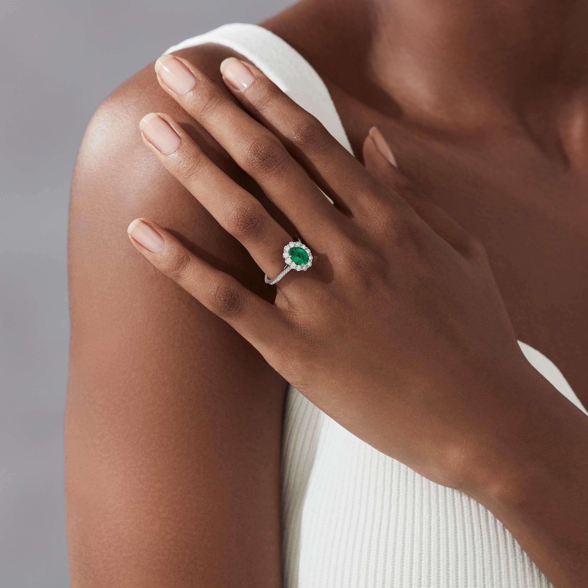 Garrard 1735 jewellery Emerald Oval Ring in Platinum with diamonds JR17PT01 and earrings On Model