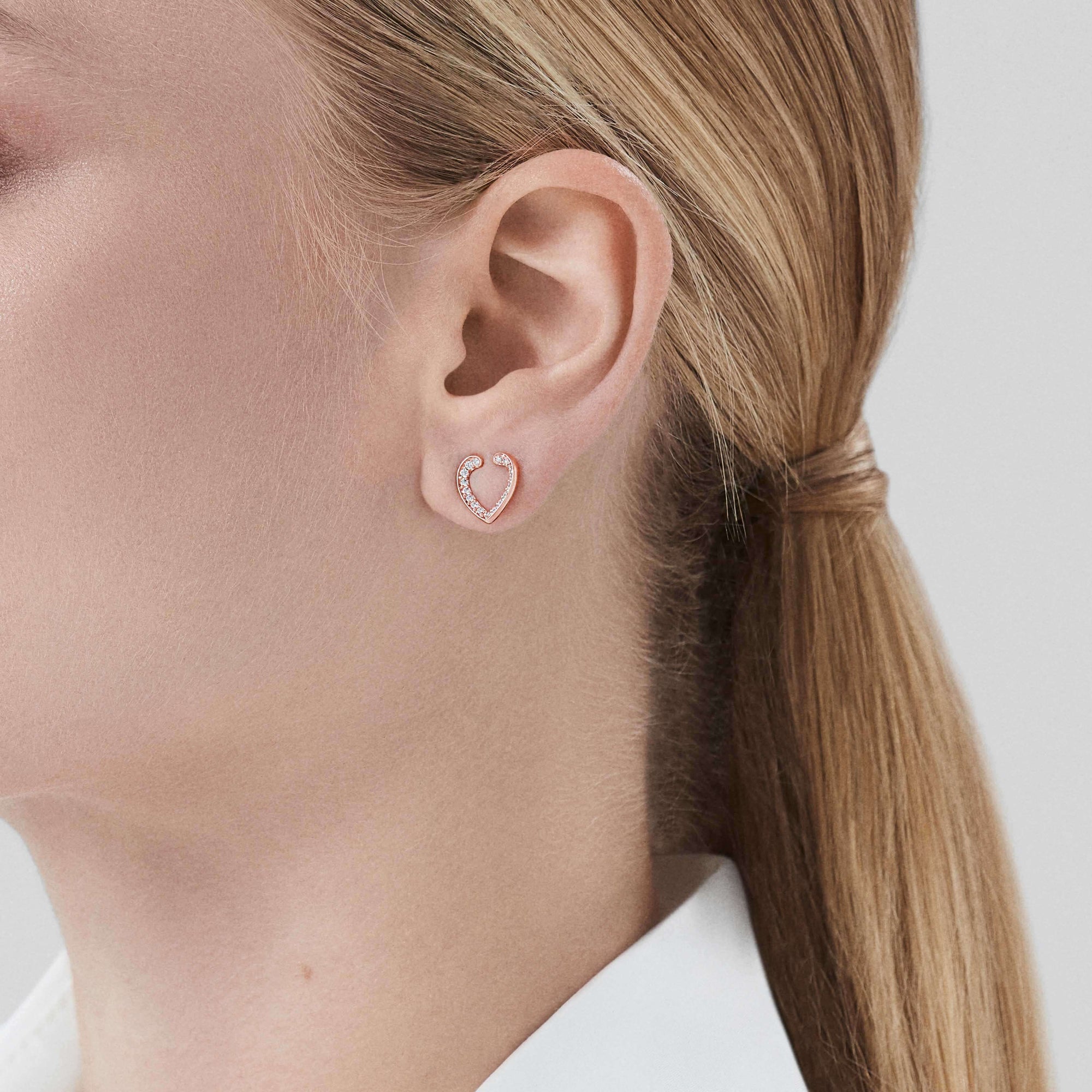 Garrard Aloria Mini Icon collection white diamond earrings in 18ct rose gold 2018646 On Model