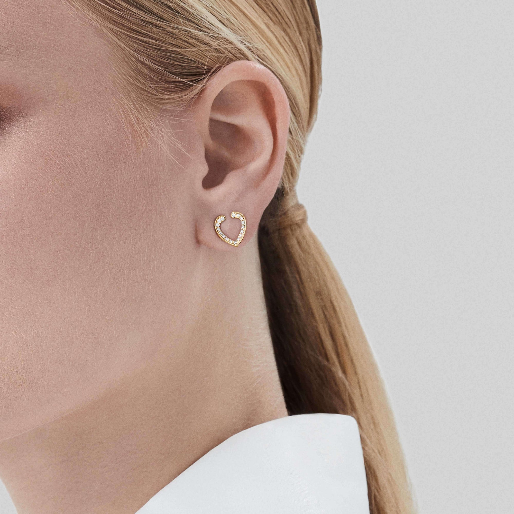 Garrard Aloria Mini Icon collection white diamond earrings in 18ct yellow gold 2018648 On Model