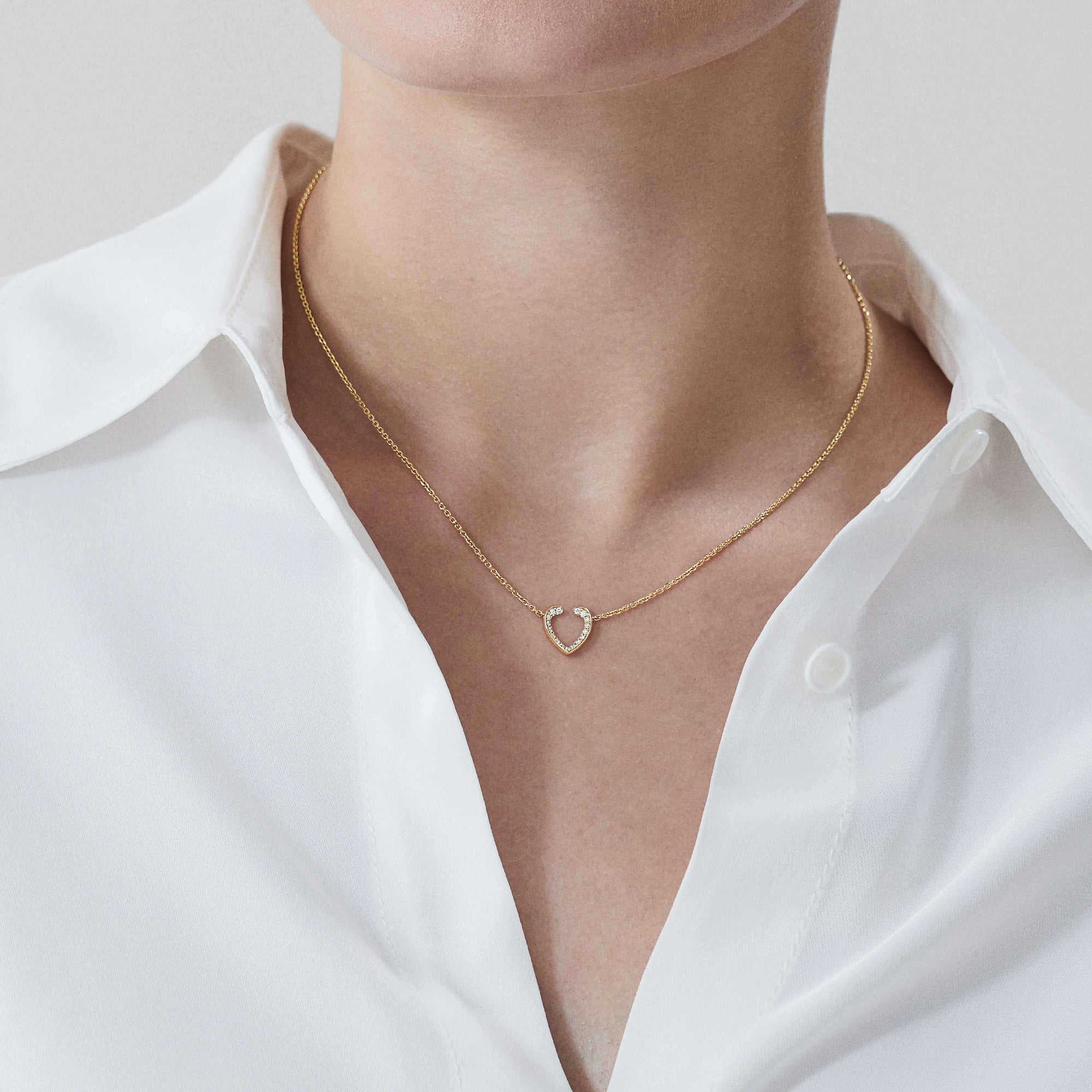 Garrard Aloria Mini Icon collection white diamond pendant in 18ct yellow gold 2018645 On Model