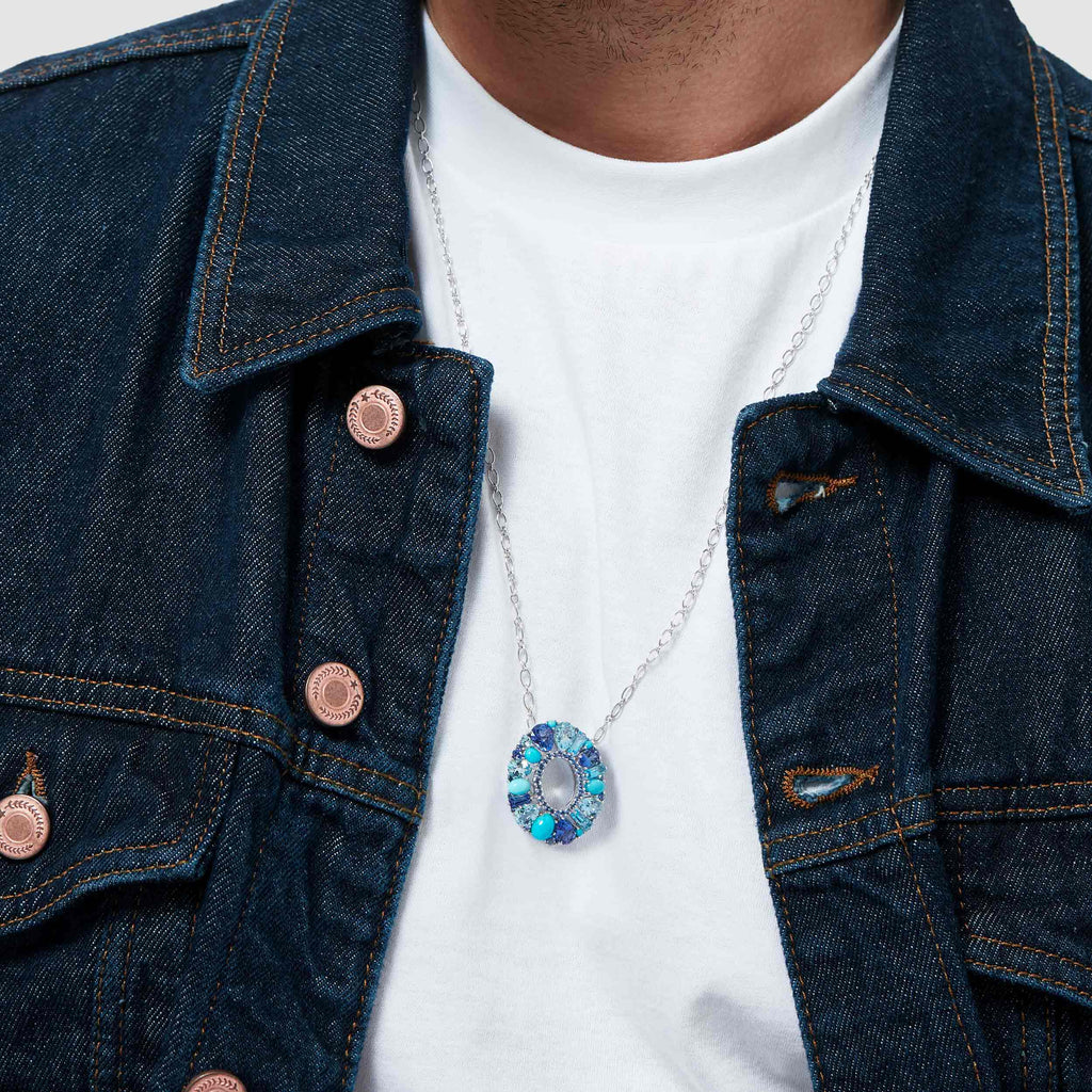 Garrard Blaze Collection 18ct white gold pendant with blue sapphires tanzanites aquamarines blue topaz and turquoise 2017649 male model
