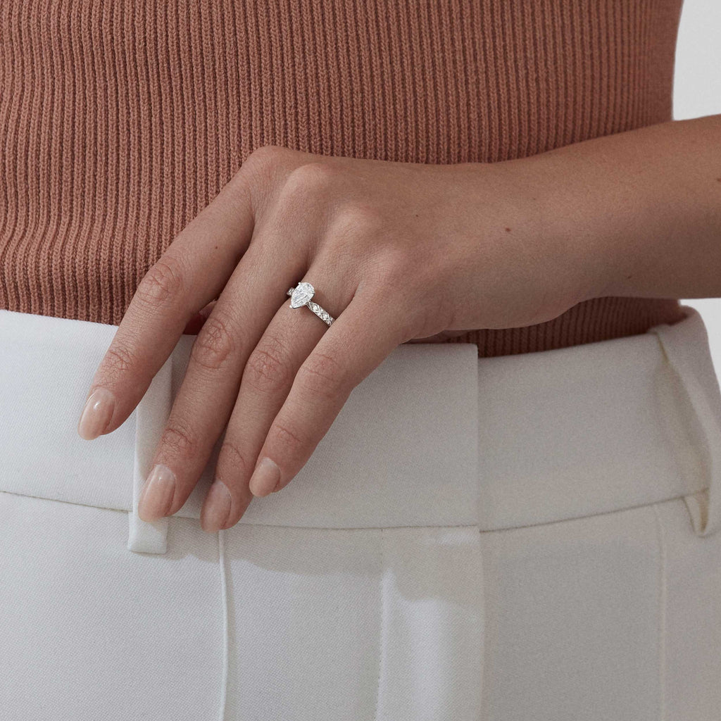 Garrard Bridal collection Signature Pear Shape Diamond Solitaire Engagement Ring In Platinum with Diamonds JRSGPT01 2017577 Model