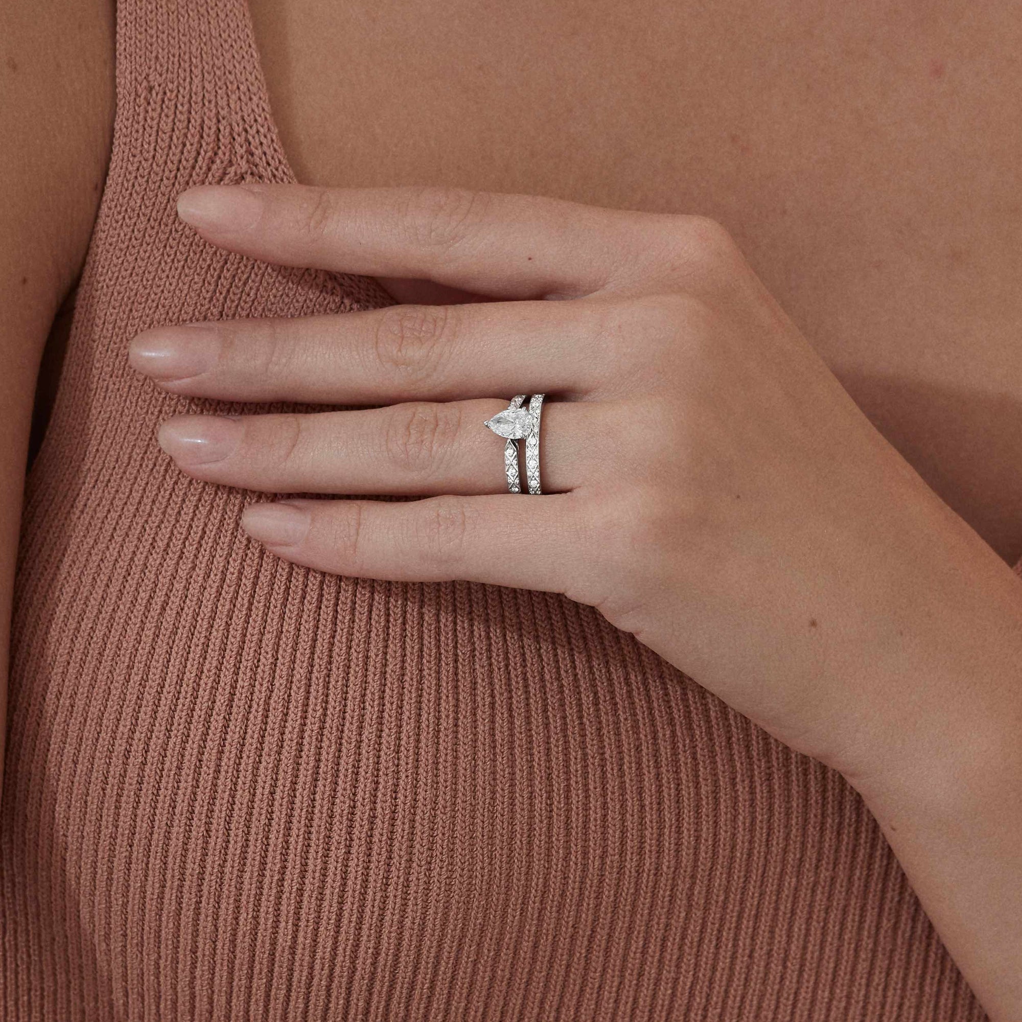 Garrard Bridal collection Signature Pear Shape Diamond Solitaire Engagement Ring In Platinum with Diamonds JRSGPT01 2017577 and wedding band 2014996 Model