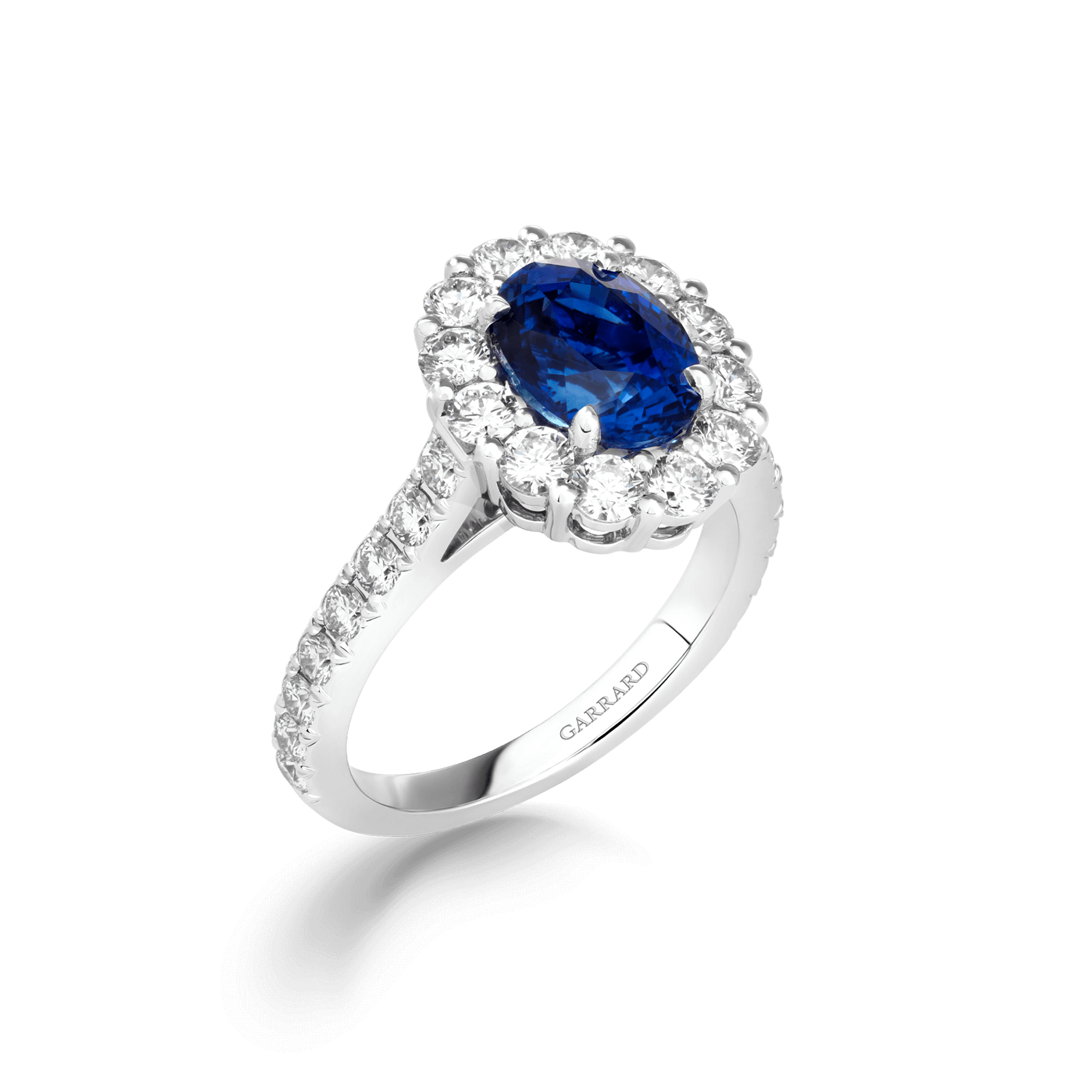 Jewelled Vault 3.05cts Oval Royal Blue Sapphire and Diamond Cluster Ring | In Platinum