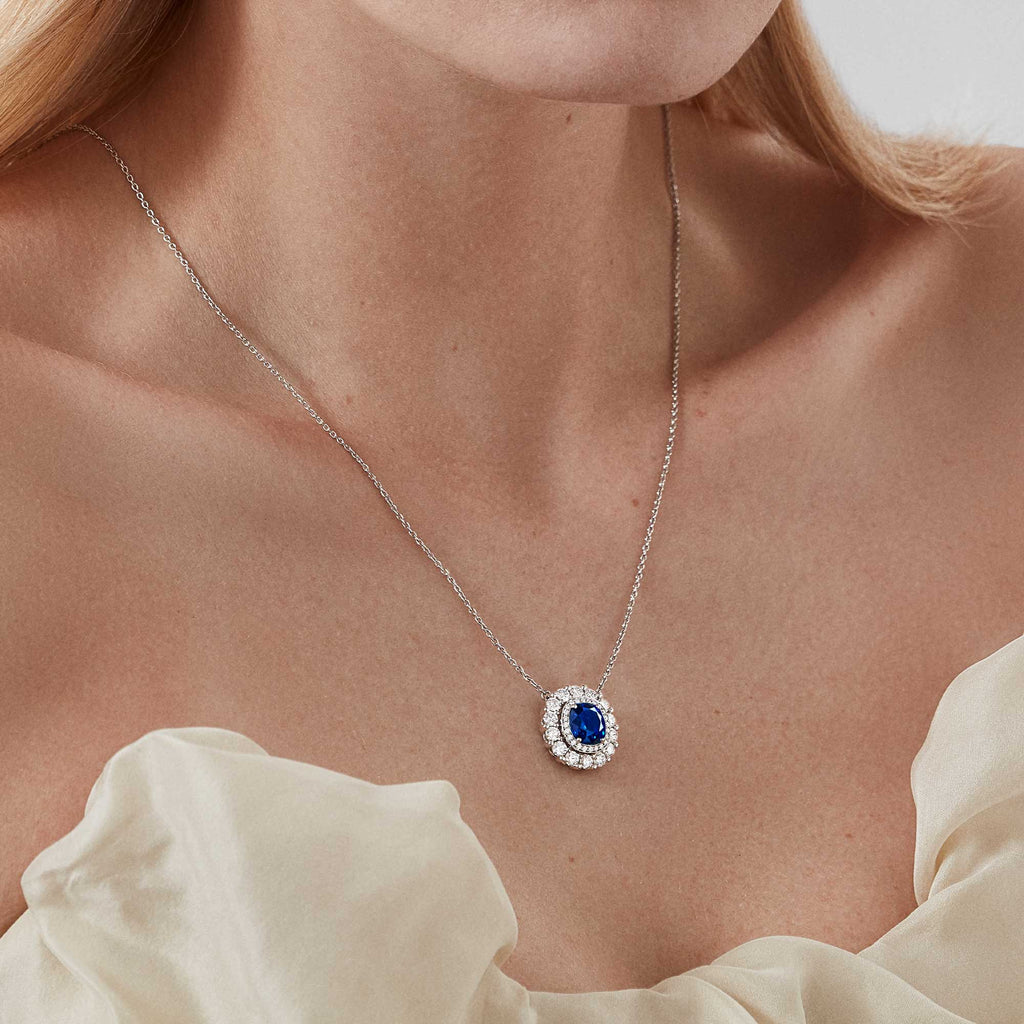Garrard Jewelled Vault pendant with a central cushion cut sapphire with a round white diamond double surround 2017704 model